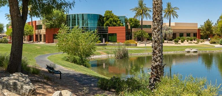 Building and man-made lake at ASU Research Park